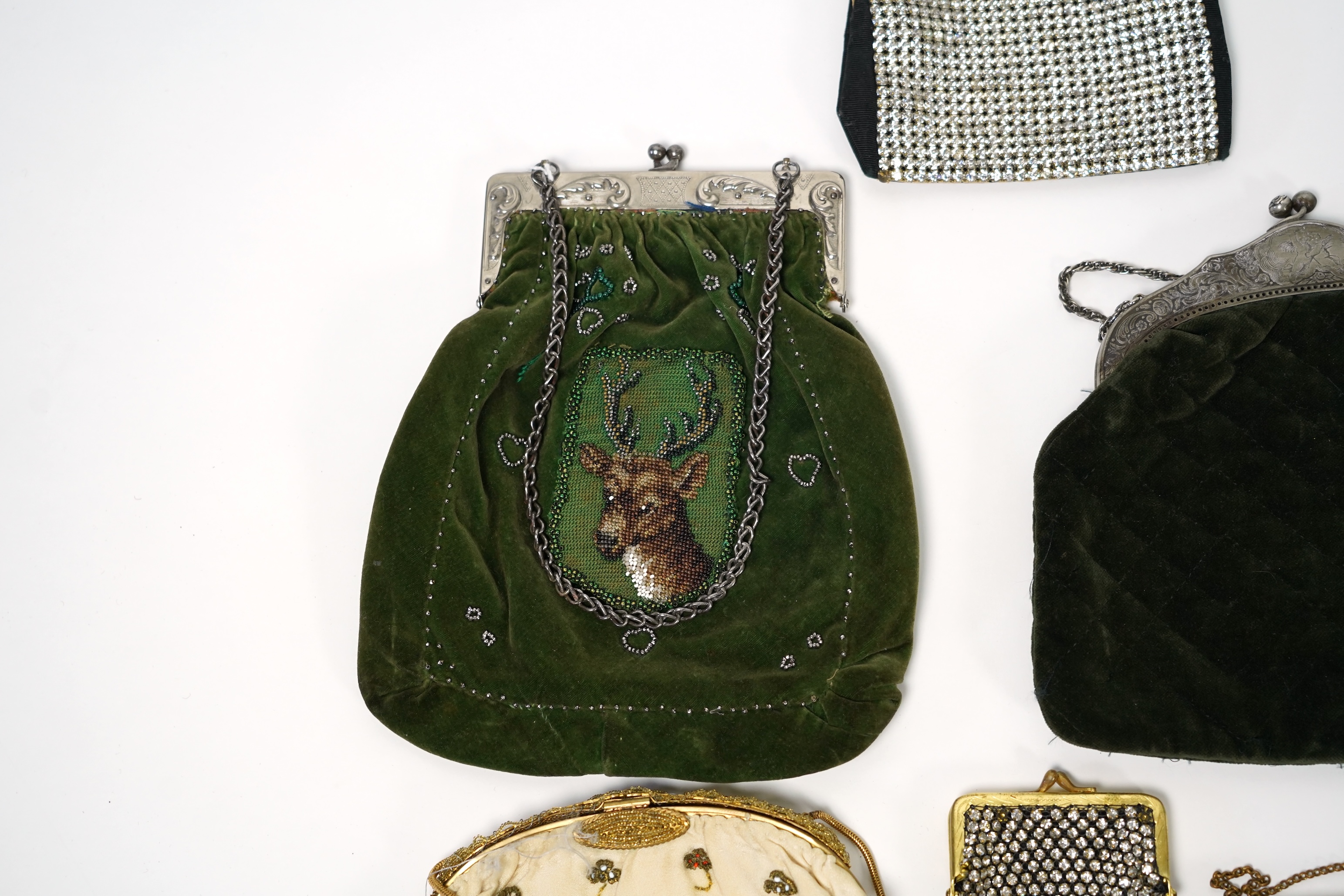 Mixed evening bags; including a 19th century velvet and cut steel handbag, a similar bag, three later gold metallic embroidered evening bags, a mixed metalic evening bag and a diamonte bag and purse (8)
